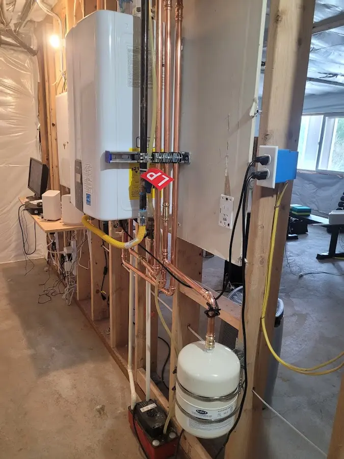 Licensed plumber repairing a kitchen sink in Kalaheo